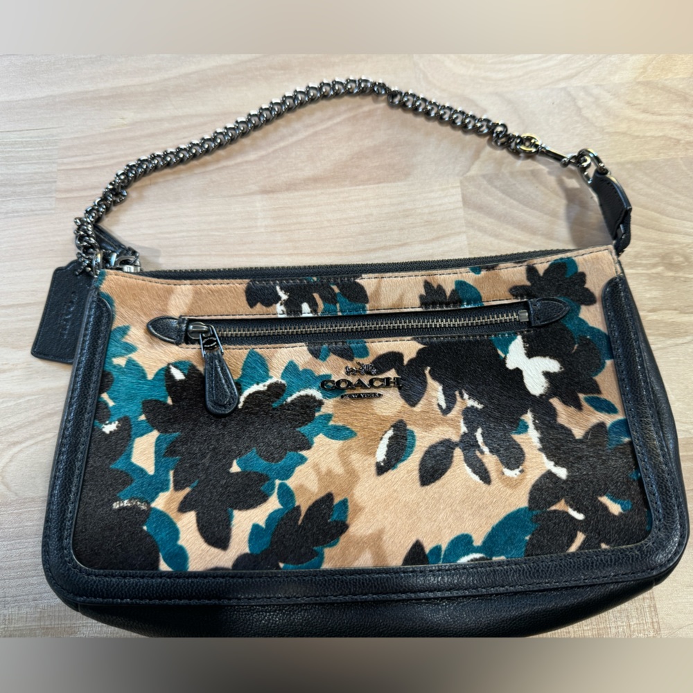 Coach cow fur, leather wristlet.